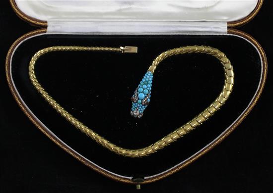 A late Victorian gold, diamond, turquoise and ruby serpent necklace in a fitted Johnson, Walker & Tolhurst gilt tooled leather box.